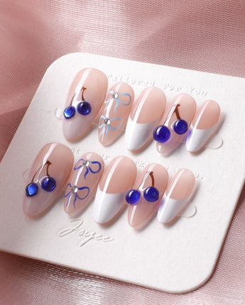 Klein Blue Cherry handmade nails with crisp French tips and cobalt blue cherries