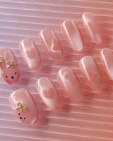 Thump Bunny handmade bunny nail art with peach cat-eye glow