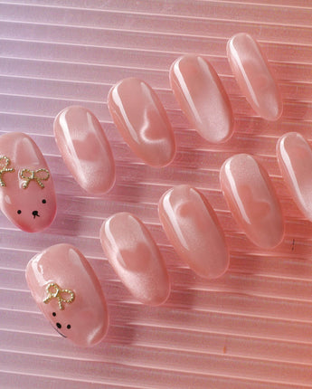 Thump Bunny handmade bunny nail art with peach cat-eye glow