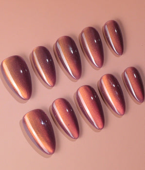 Rose Brew nail art close-up showing Maroon cat eye nails details
