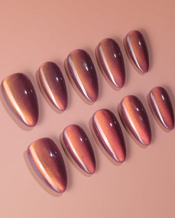 Rose Brew nail art close-up showing Maroon cat eye nails details