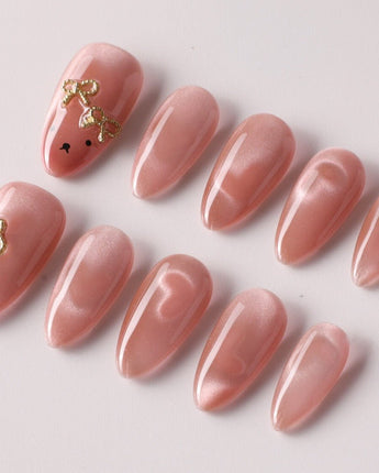 Thump Bunny cute press-on manicure with soft pink cat-eye finish
