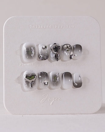Night Butterfly press-on nails in extra short squoval shape — black ombre chrome 3D gothic nails