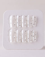 Glitz Galore press-on nails in medium square shape — milky white rhinestone nails