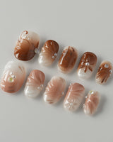 Brown & Khaki press-on nails in short oval with muted brown and khaki nail design