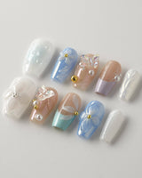 Aqua Petal handmade blue floral nails with 3D butterfly charm and glossy finish