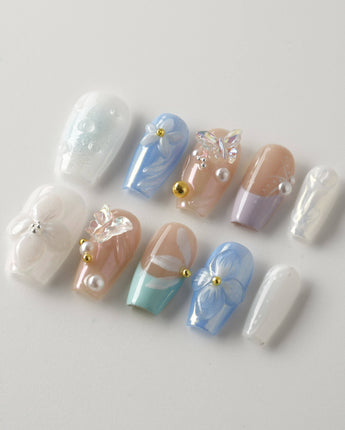 Aqua Petal handmade blue floral nails with 3D butterfly charm and glossy finish