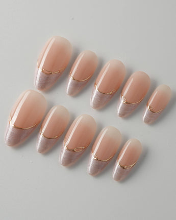Your Glow nails with neutral French tips, gold wire accents, and polished gel shine