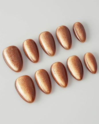 Light Brown Cat-eye press-ons with warm taupe brown color and glossy magnetic effect
