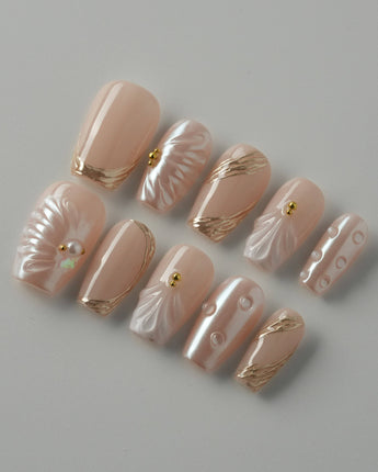 Venus pearly nude 3D shell nail set with glossy gold-accented details