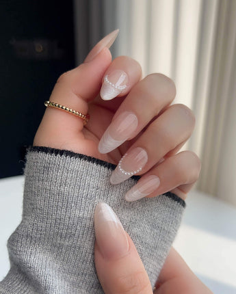 Dew Sparkle nude French tip press-ons with glossy gel finish and delicate pearl accents