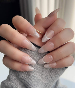Dew Sparkle press-on nails with soft nude French tips and pearly silk-like shine