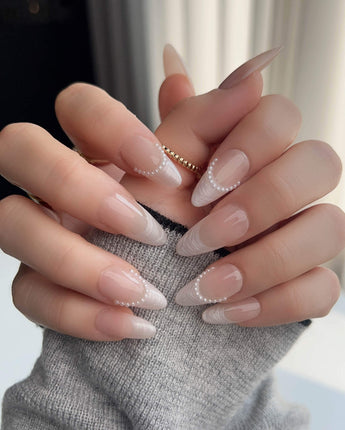 Dew Sparkle press-on nails with soft nude French tips and pearly silk-like shine
