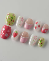 Haru Picnic Set picnic-inspired nail art with berries, flowers, and glossy gel finish
