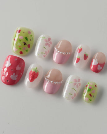 Haru Picnic Set picnic-inspired nail art with berries, flowers, and glossy gel finish