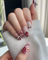 KT Cake press-on nails in L medium almond with sweet cake accents and soft fall colors