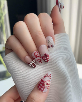 KT Cake press-on nails in L medium almond with sweet cake accents and soft fall colors