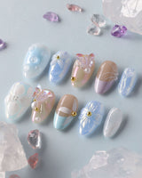 Aqua Petal custom nails with aqua pastel base, raised blossoms, and butterfly nail art