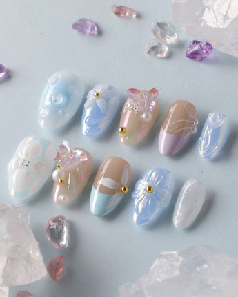 Aqua Petal custom nails with aqua pastel base, raised blossoms, and butterfly nail art