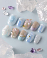 Aqua Petal close-up of pastel blue floral nails with 3D butterfly texture