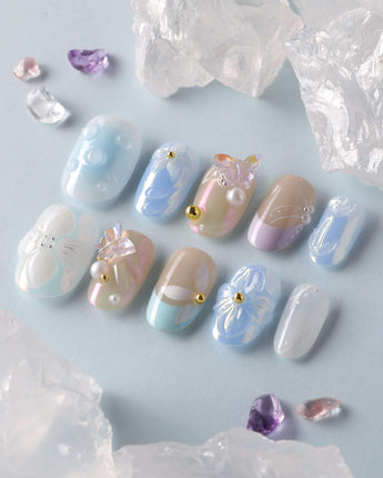 Aqua Petal close-up of pastel blue floral nails with 3D butterfly texture