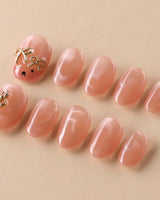 Thump Bunny soft peach cat-eye nails with sweet heart and bunny styling