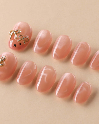 Thump Bunny soft peach cat-eye nails with sweet heart and bunny styling
