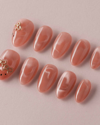 Thump Bunny handmade press-on nails with pink shimmer and playful bunny charm