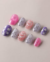 Charming Glam Usagi extra short oval nails with playful glam details and glossy gel polish