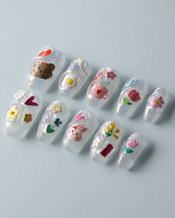 Squishy Pop short coffin nails with bright decals and cute tactile-looking gel accents