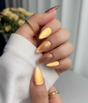 Aurora Flame press-on nail set — orange & gold cat eye design, hand-painted with real gel polish