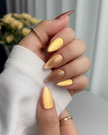Aurora Flame press-on nail set — orange & gold cat eye design, hand-painted with real gel polish