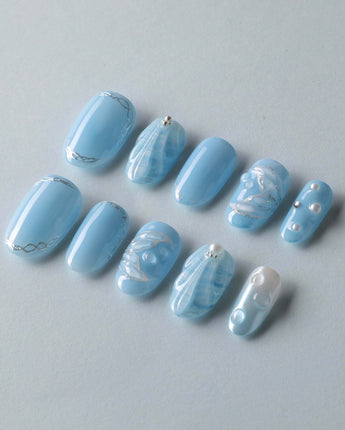 Mermaid Nail Designs Tale reusable nails with sea-blue shimmer and dimensional accents