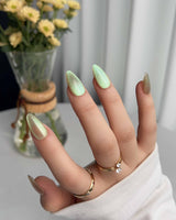 Aurora Mist nail art close-up showing Champagne Nude, Green Aurora Cat Eye. details