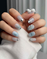 Miffy Summer handmade nails with bunny bow detail, silver tips, and clean pastel styling