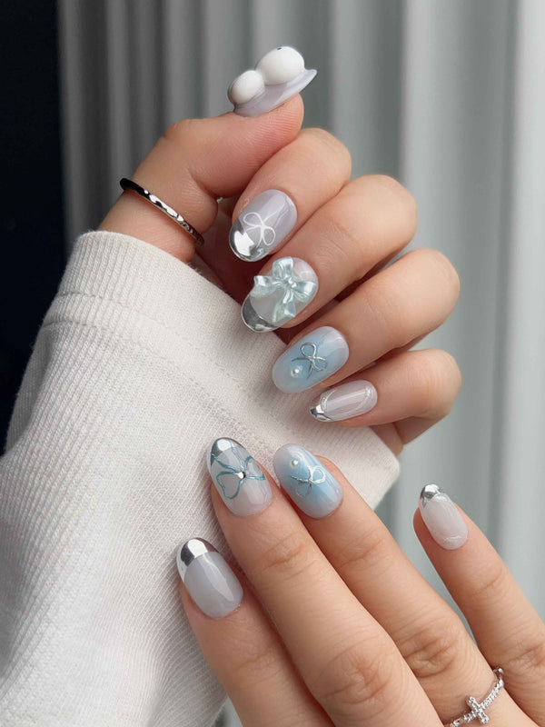 Miffy Summer short oval nails with baby blue white French mix, silver tips, bunny bow, and 3D accents