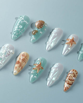 Mauritius Escape ocean-inspired press-on nails with iridescent white and mint gel