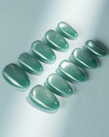 Mint Orb press-on nail set — Glacier Green Cat Eye design, hand-painted with real gel polish