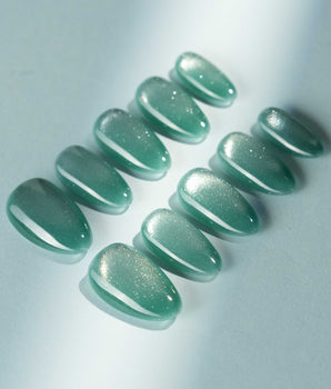 Mint Orb press-on nail set — Glacier Green Cat Eye design, hand-painted with real gel polish