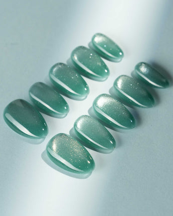Mint Orb press-on nail set — Glacier Green Cat Eye design, hand-painted with real gel polish