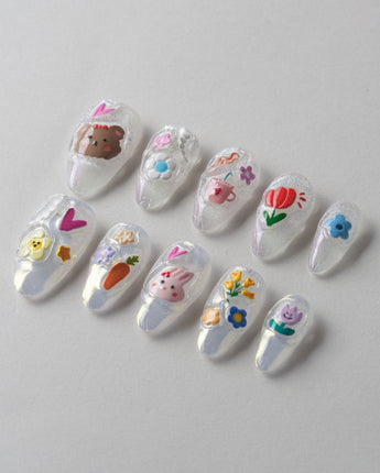Squishy Pop short almond press-ons with cheerful decal nail art