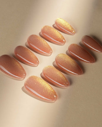 Aurora Flame nail art close-up showing orange & gold cat eye details