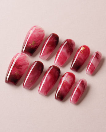 Gone with the Wind press-on nails with marbled burgundy and gold foil accents