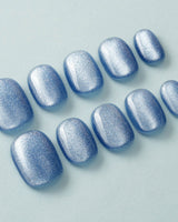 Sky Cat-eye nail art close-up showing blue cat eye nails details