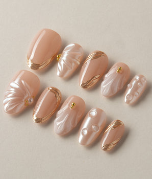 Venus handmade press-on nails featuring Pearly Nude, 3D Shells & Gold.