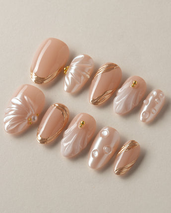 Venus handmade press-on nails featuring Pearly Nude, 3D Shells & Gold.