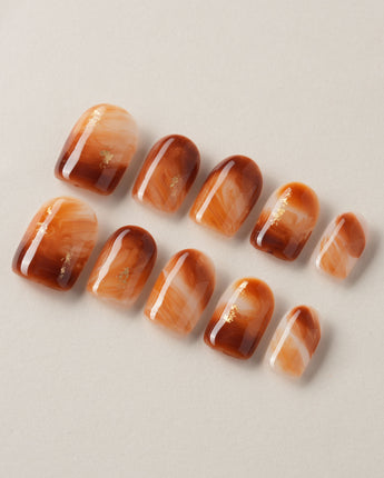 Onyx Shine nails with caramel amber marble color and dark glossy dimension