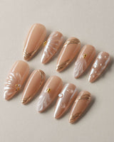 Venus pearly shell manicure set with glossy nude finish and gold accents