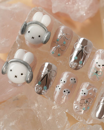 Miffy's Vacay handmade nails with glossy chrome shine and playful headphone rabbit detail