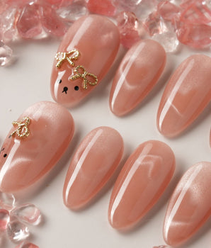 Thump Bunny handmade press-on nails featuring Peach Heart Cat-eye